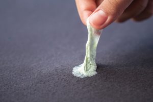 Removing sticky chewing gum from clothes