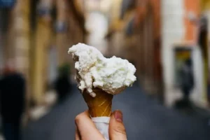 an ice cream being held