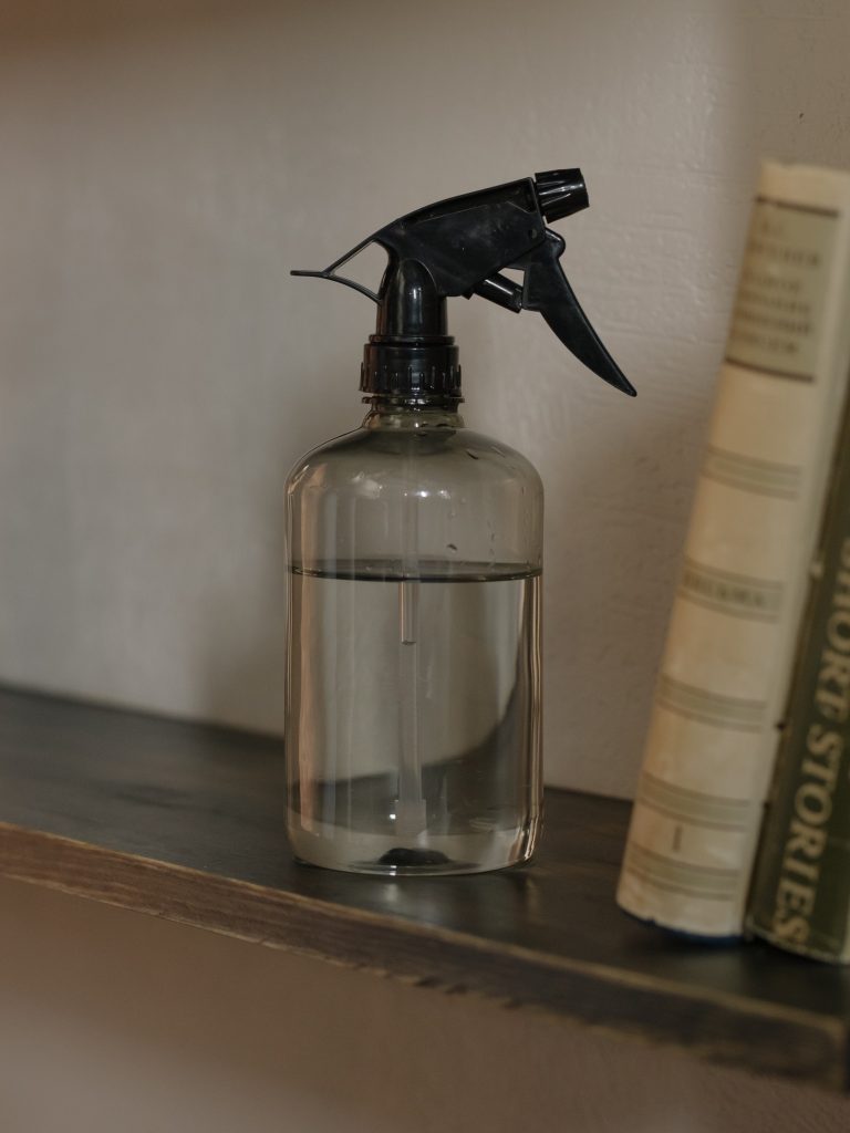 a spray bottle for dampening clothes