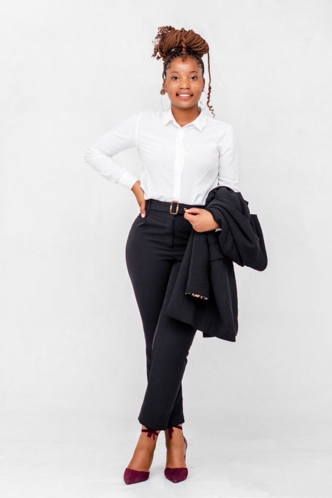 woman in a white shirt and black pants