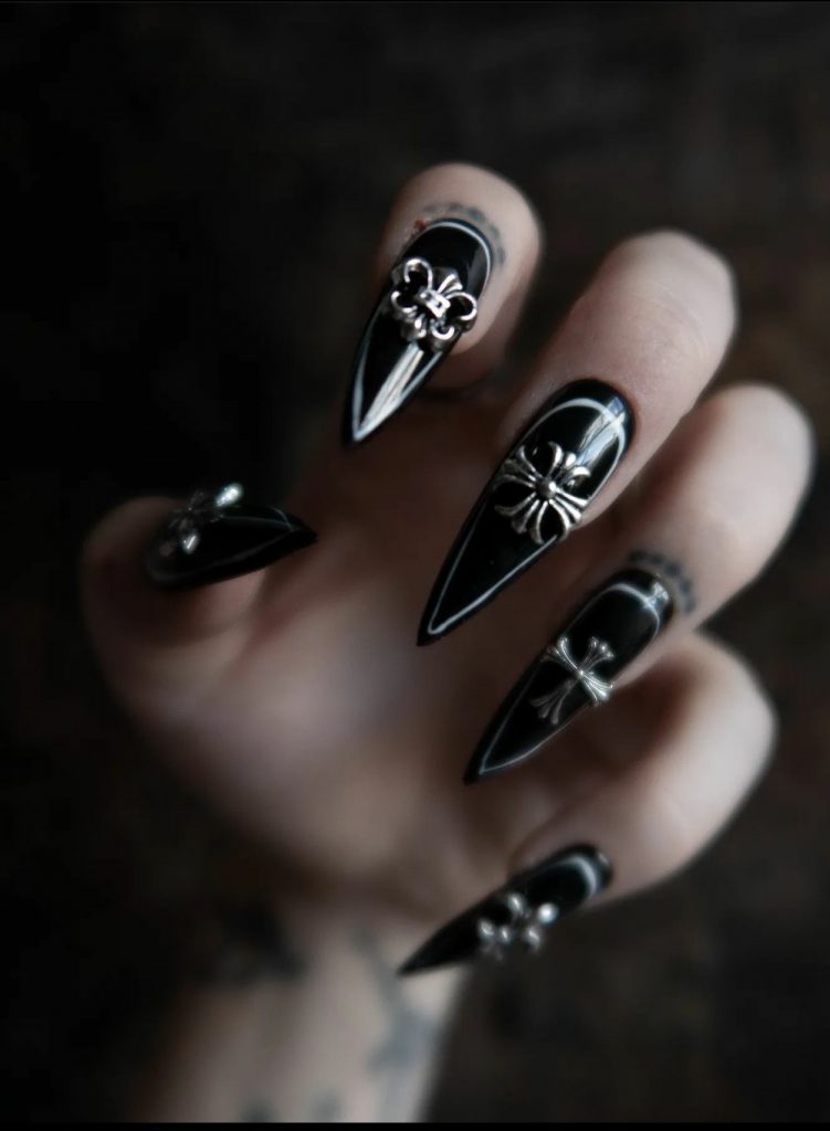 Black nails with metal embellishments