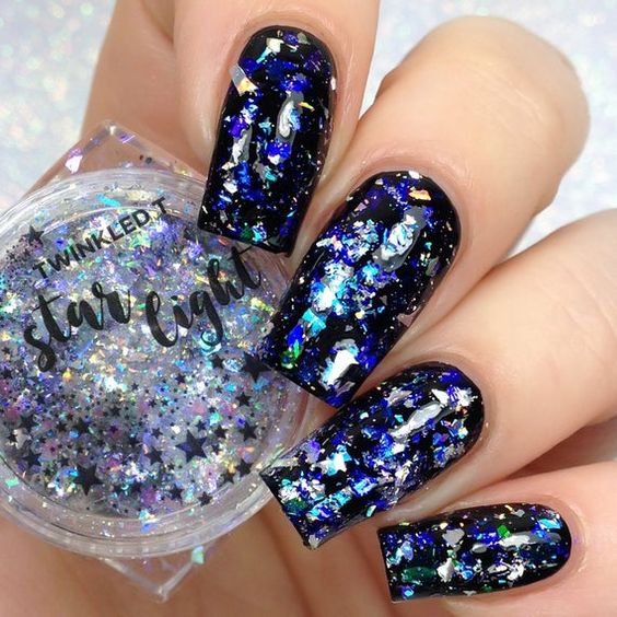 dramatic blue glitter nail design 