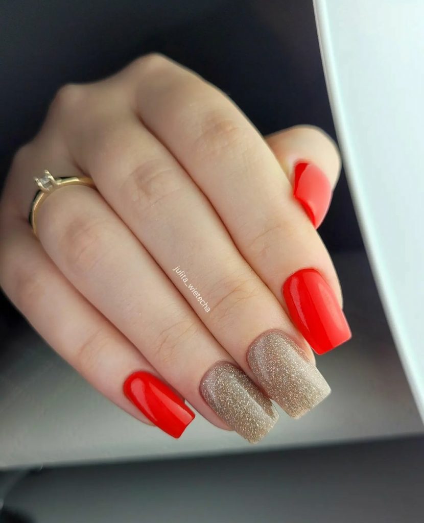 Classy red nails with fine gold glitter 