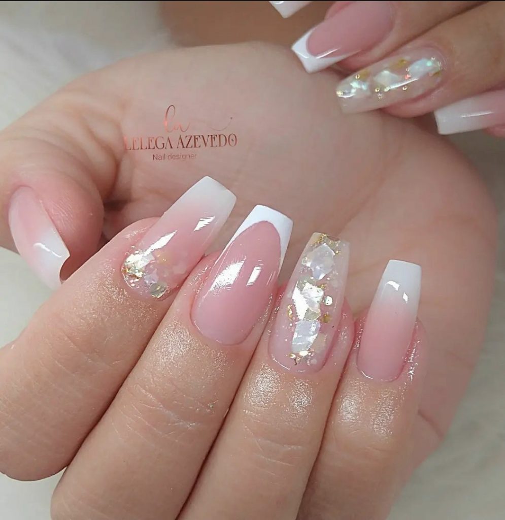 Nails with white glitter shards and gold glitter 
