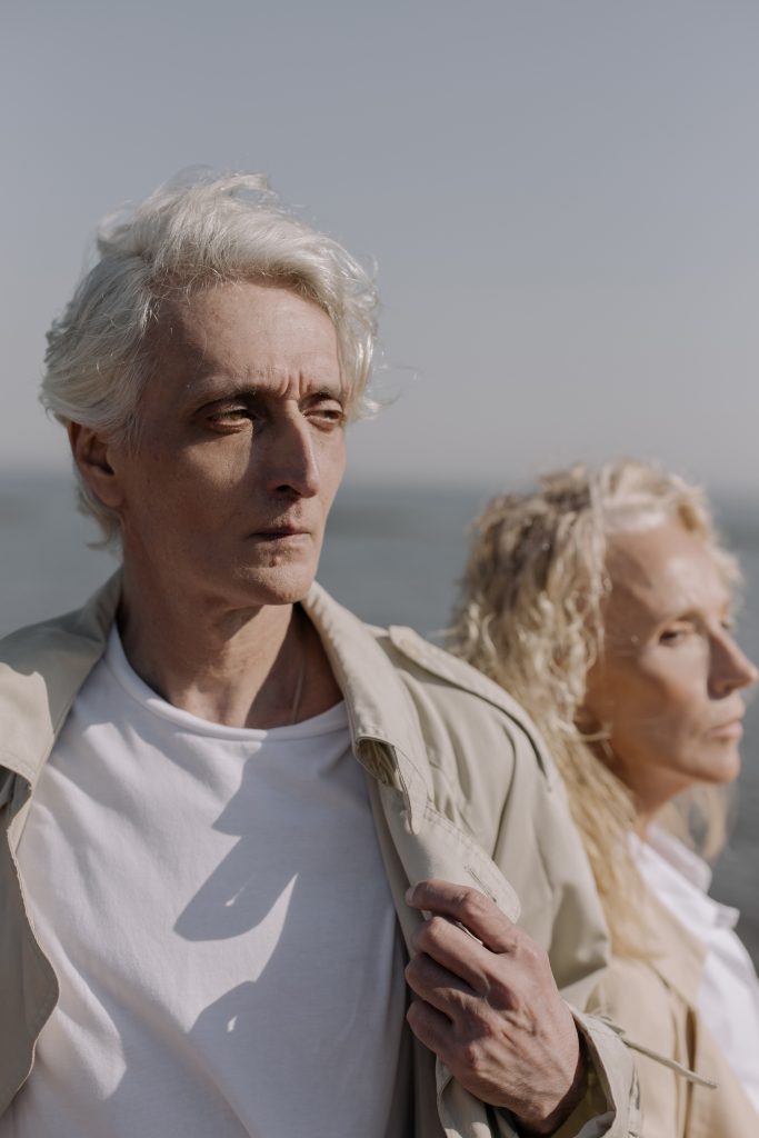 a man and woman with premature grey hair