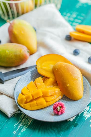 dices of ripe mangoes on a plate