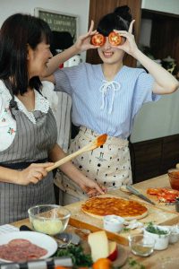 Cooking pizza with tomato sauce