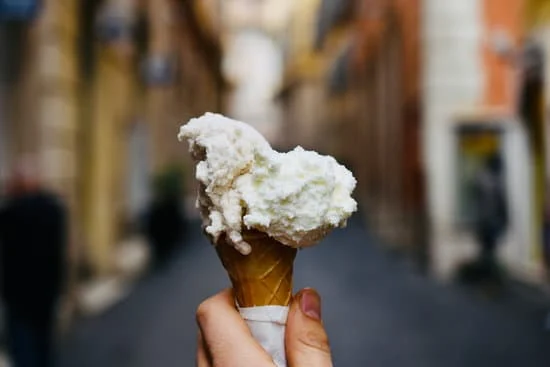 an ice cream being held