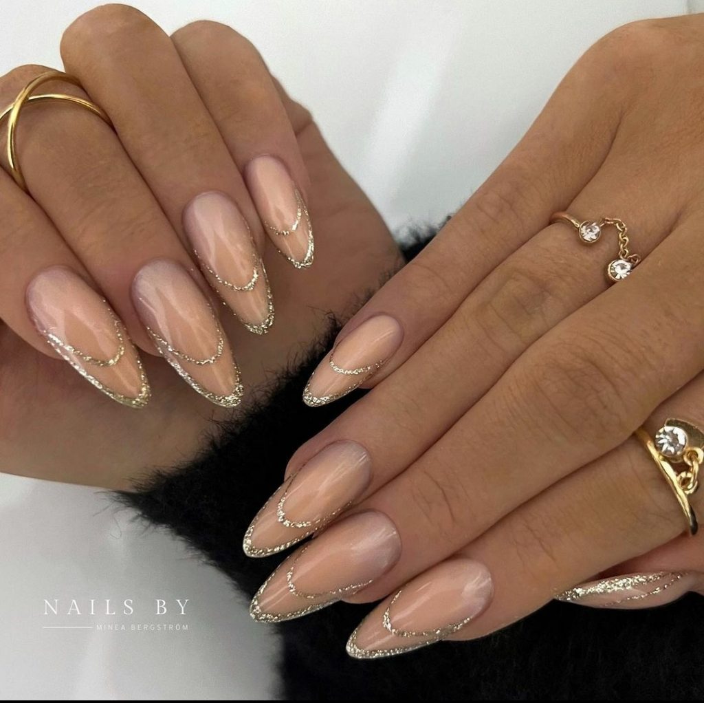 glitter tips on almond shaped stiletto nails 