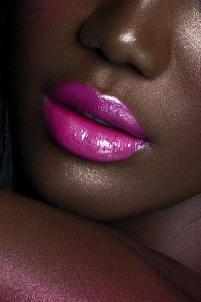 black woman in purple lipstick