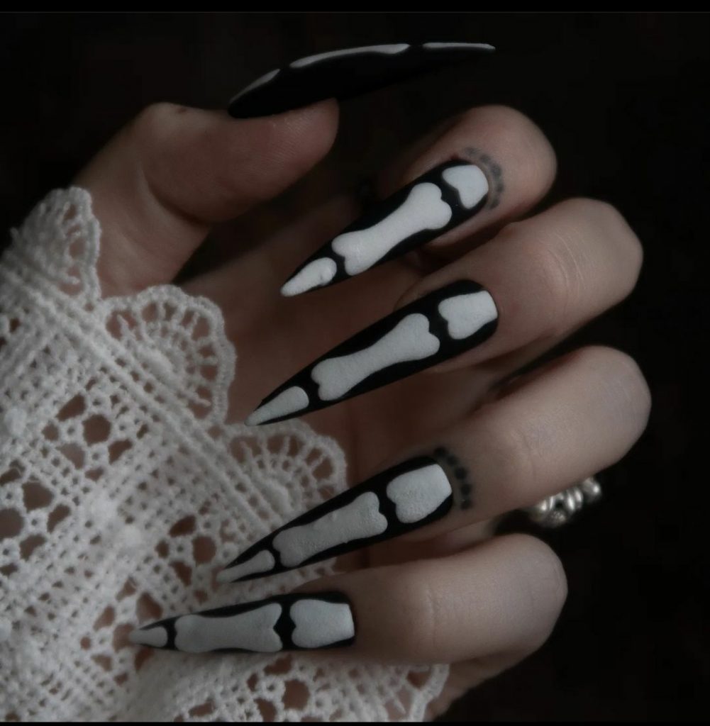 matte black stiletto nails with 3D bone design 