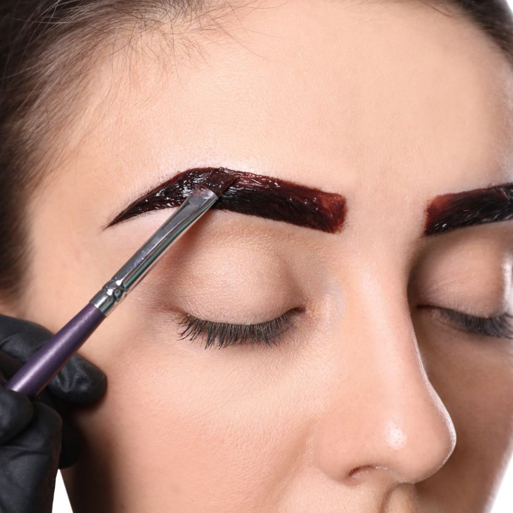woman doing eyebrow tinting 