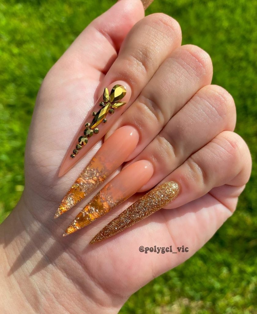 Gold stiletto nails 