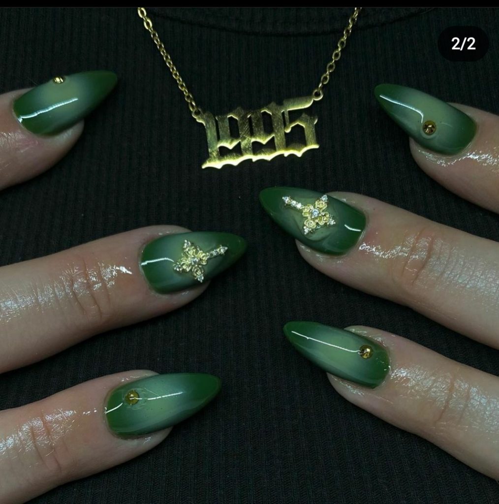 Short green stiletto nails 