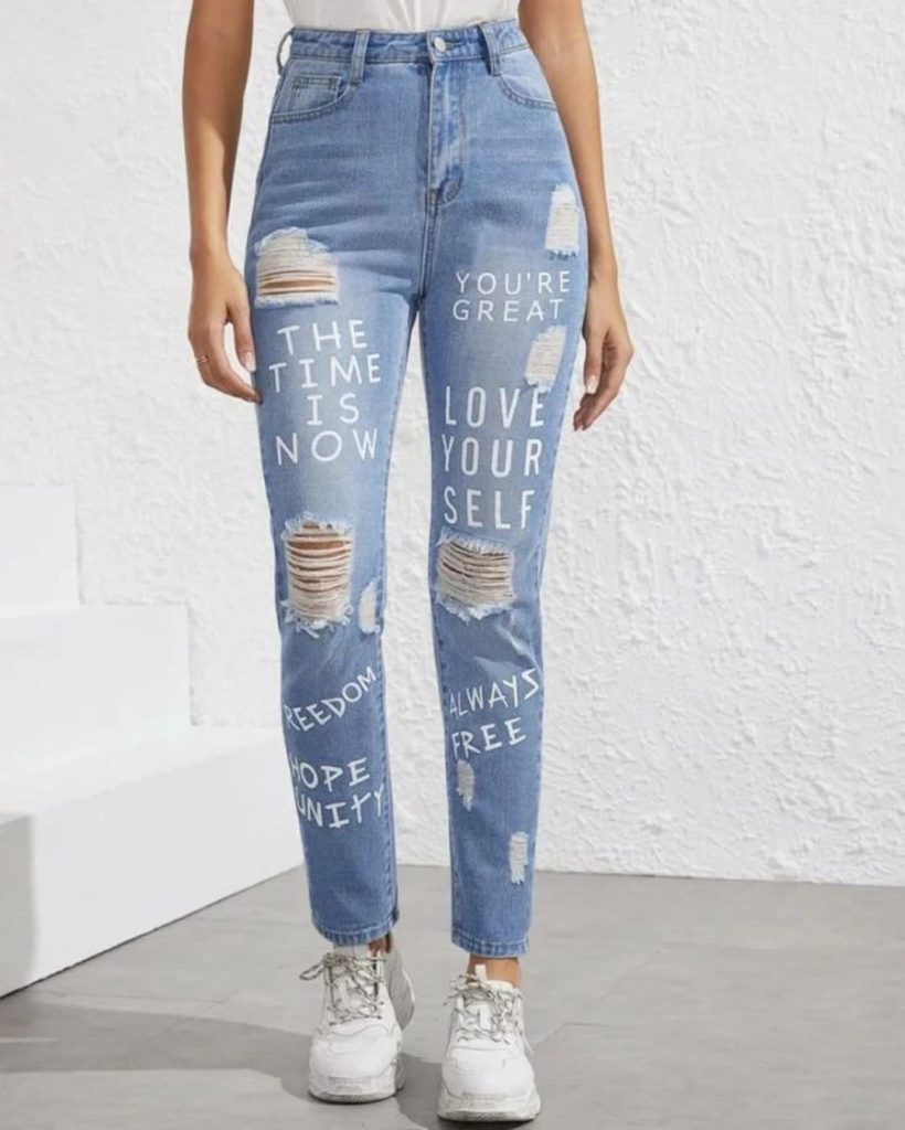 woman in a high waist distressed jeans