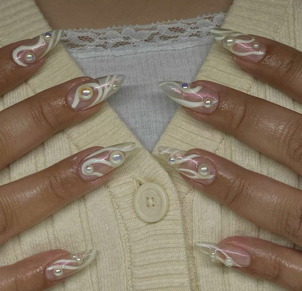 Cute white pearl stiletto nails
