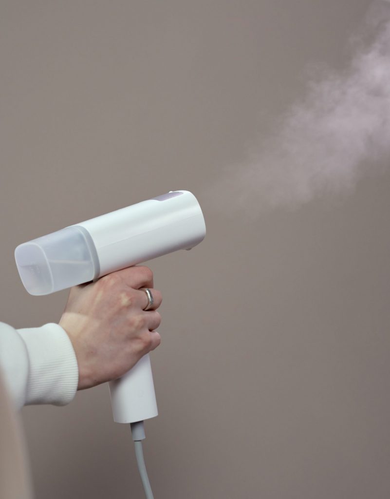 person holding a steamer