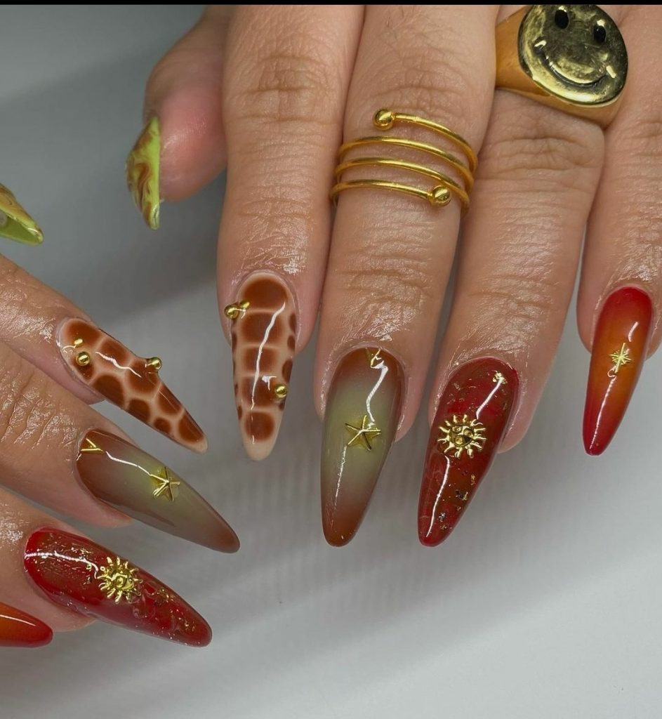 Red and gold stiletto nails