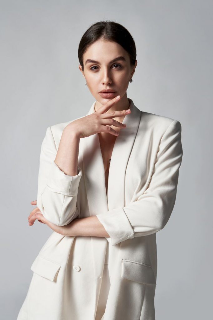woman in a white blazer