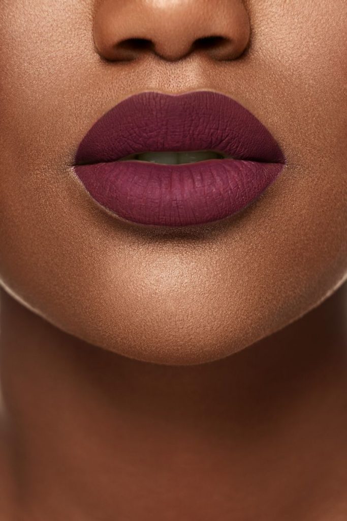 woman in burgundy lipstick