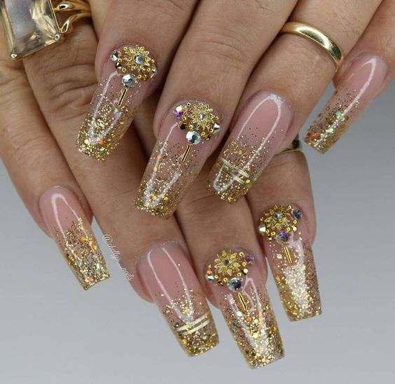 Coral pink and golden glitter ombre nails.