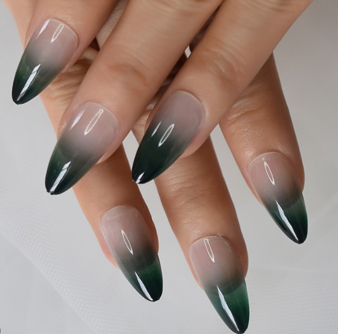 Elegant almond and jade green ombre nails with glossy finish.