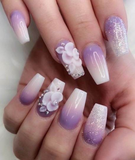 Purple and ivory ombre nails.