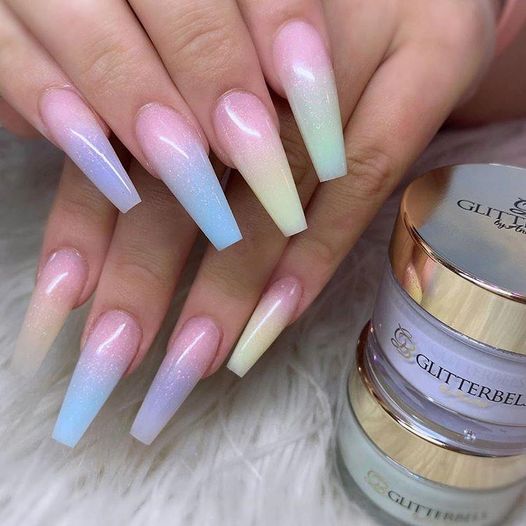 Pastel colored shimmery ombre nails.