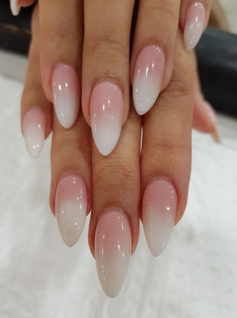 Lustrous ivory and peach nails, timeless and versatile like pearls.