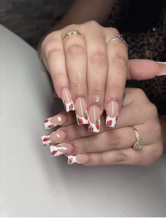 Delightful twist: white tips with playful strawberry accents.