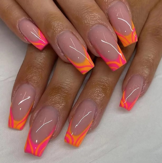 pink and orange swirl ombre nails.