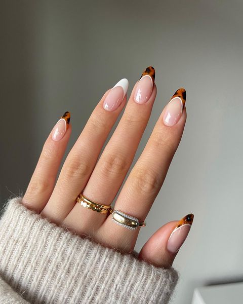 Trendy and unique tortoise-inspired nails with a modern twist.
