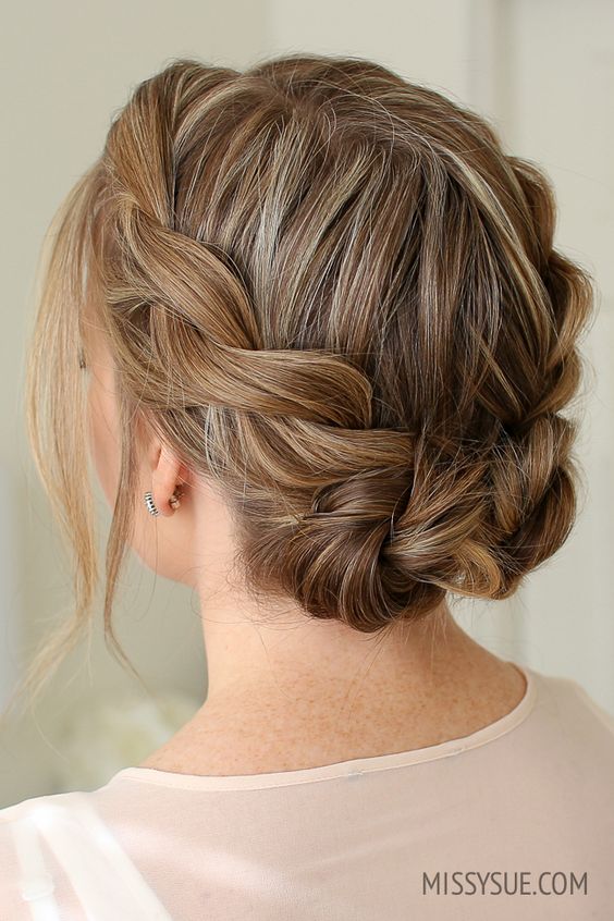 Double twist low buns, unique and stylish bridal hairstyle.