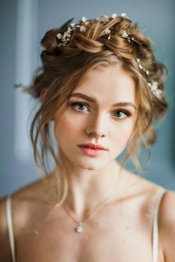Dutch braid crowned with a floral headpiece.