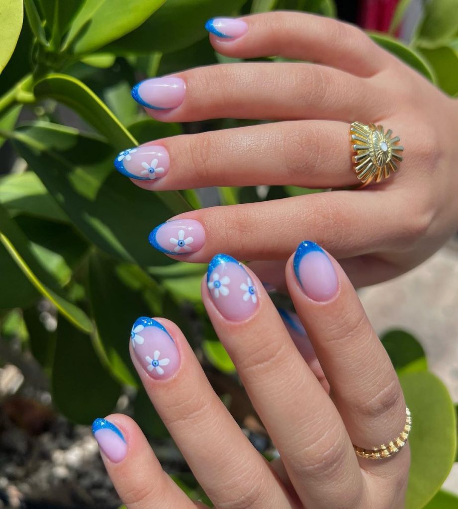 Elegant floral nails with a French twist.