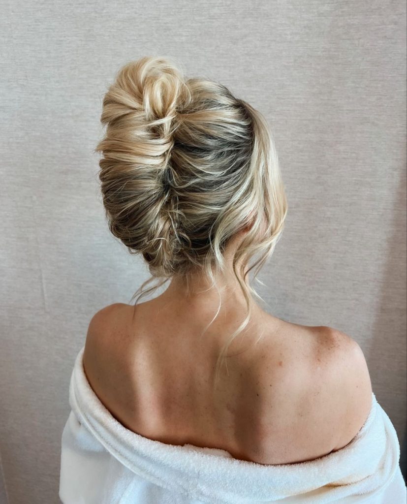 Elegant updo created with a French twist technique.
