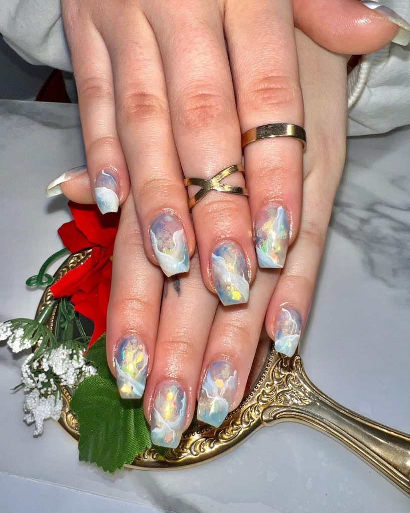 Transparent beauty on marbled nails.
