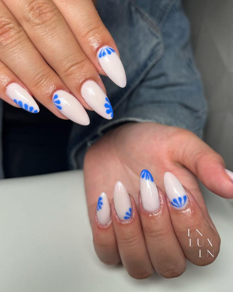 Glossy nails with a touch of Greek flair.