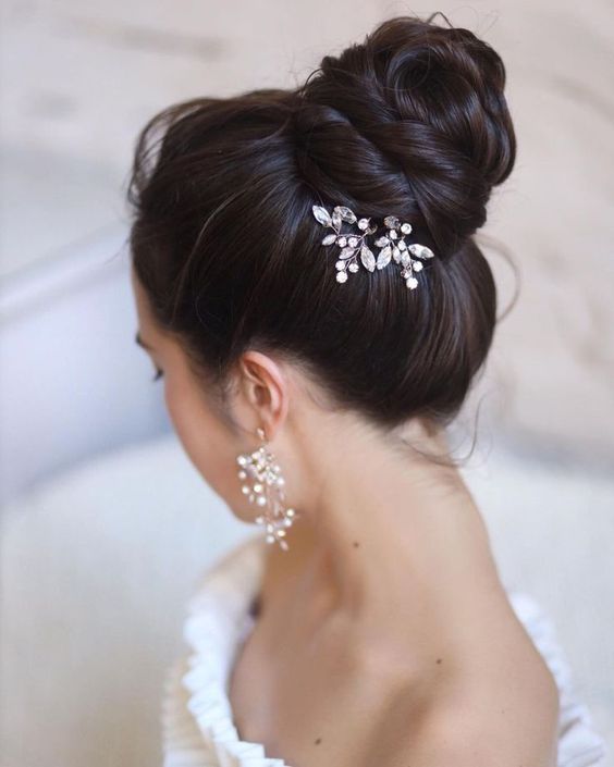 High bun with an exquisite hairpiece.