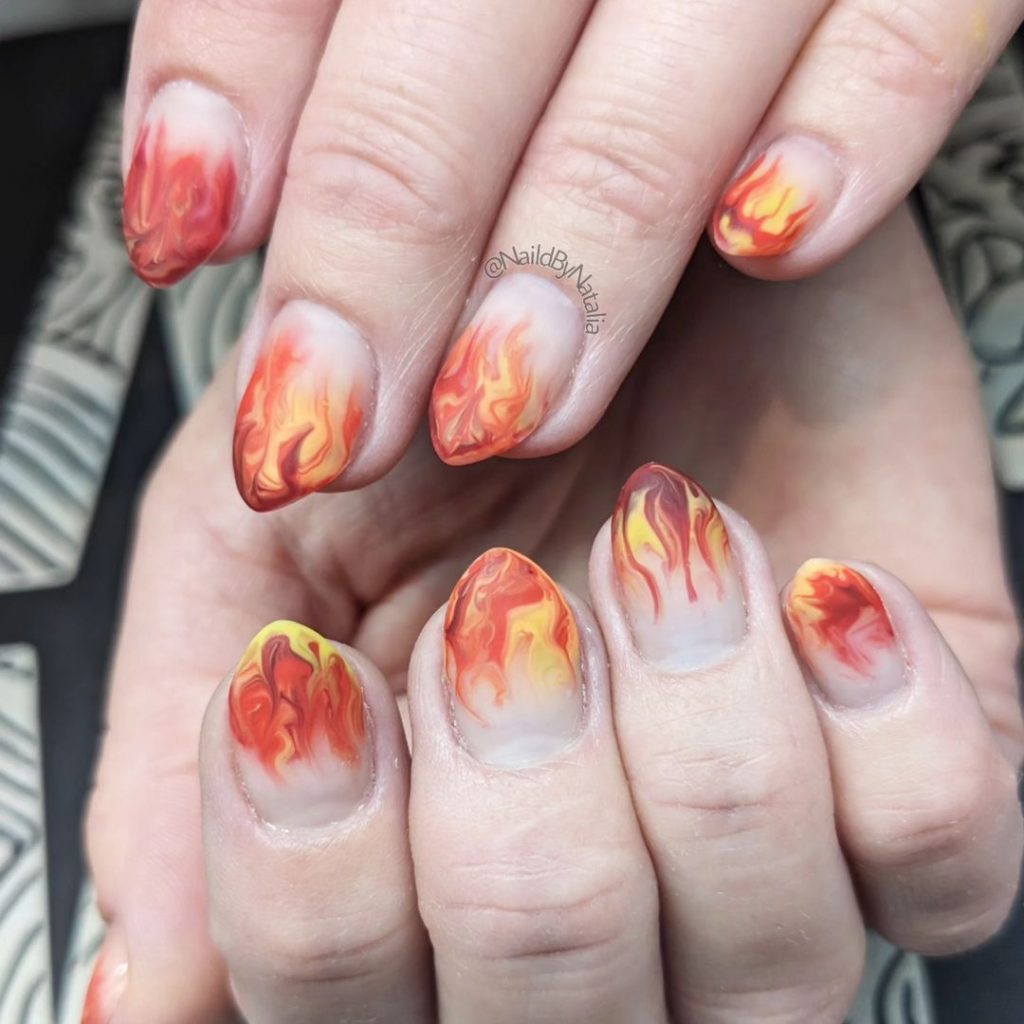Vibrant fire dances on nails.