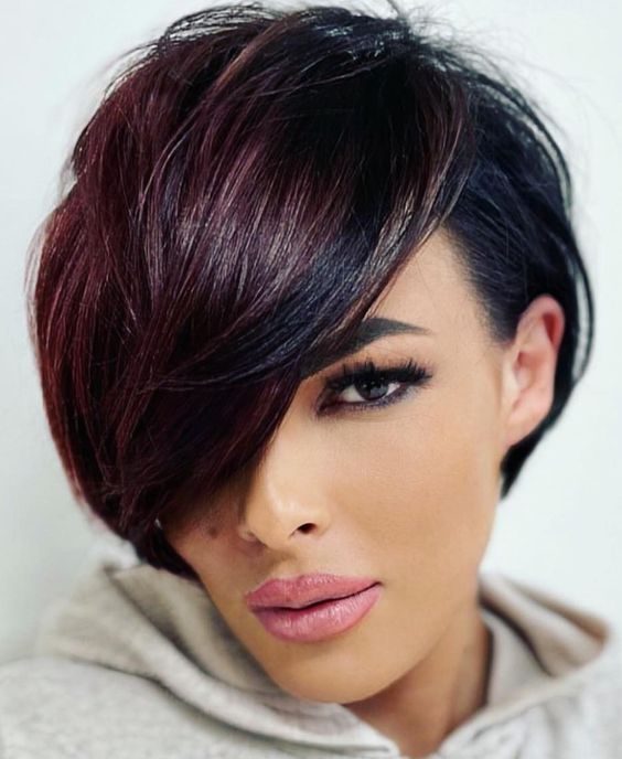 Sleek, and timeless short hairdo with a stylish side part.
