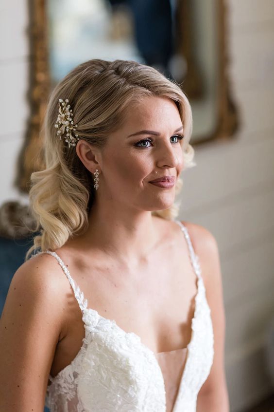 Soft curls cascading down for the perfect bridal hairstyle.