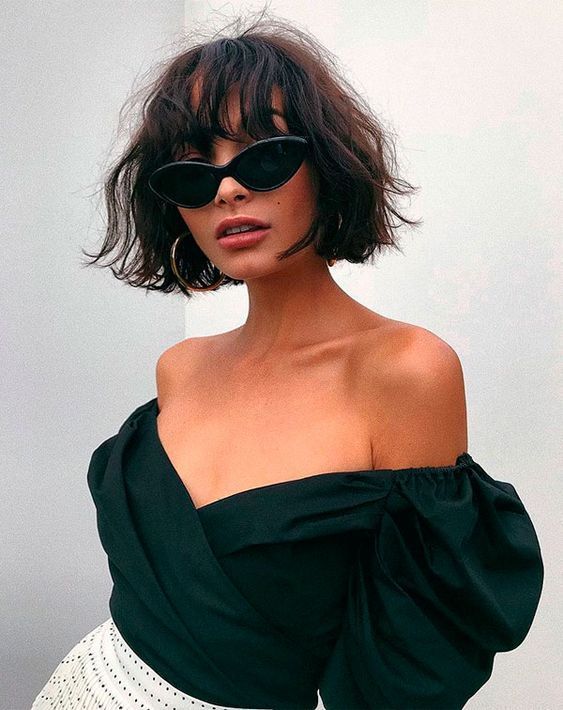 Effortlessly messy short hairdo, textured, and chic bob for an undone charm.