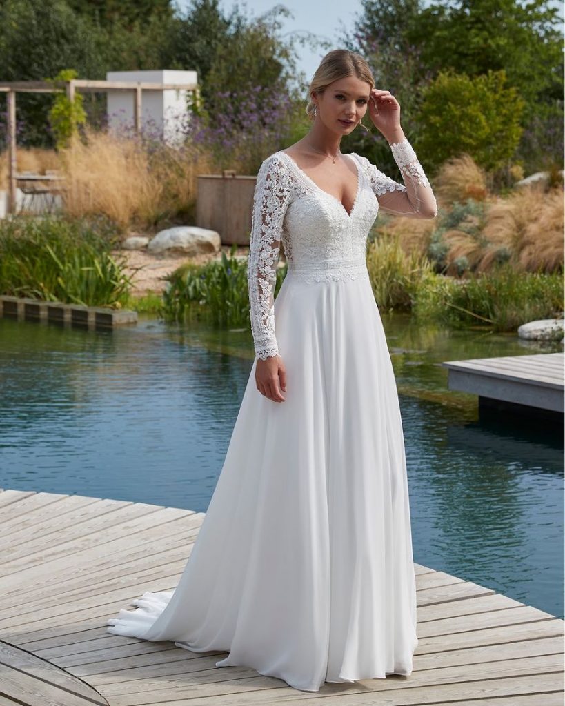 Elegant full sleeves bridal gown in V-neck style.