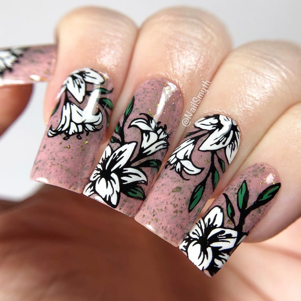 Elegantly designed nails featuring white lily motifs.
