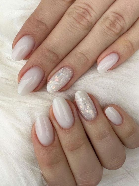 Milky white nails with a unique shape