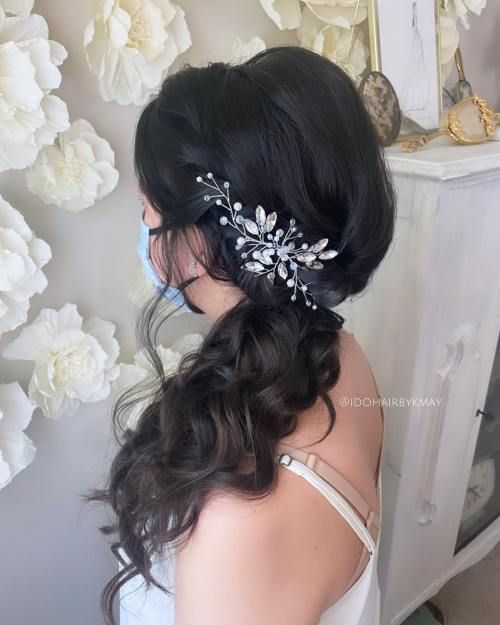 Side ponytail with a decorative hairpin