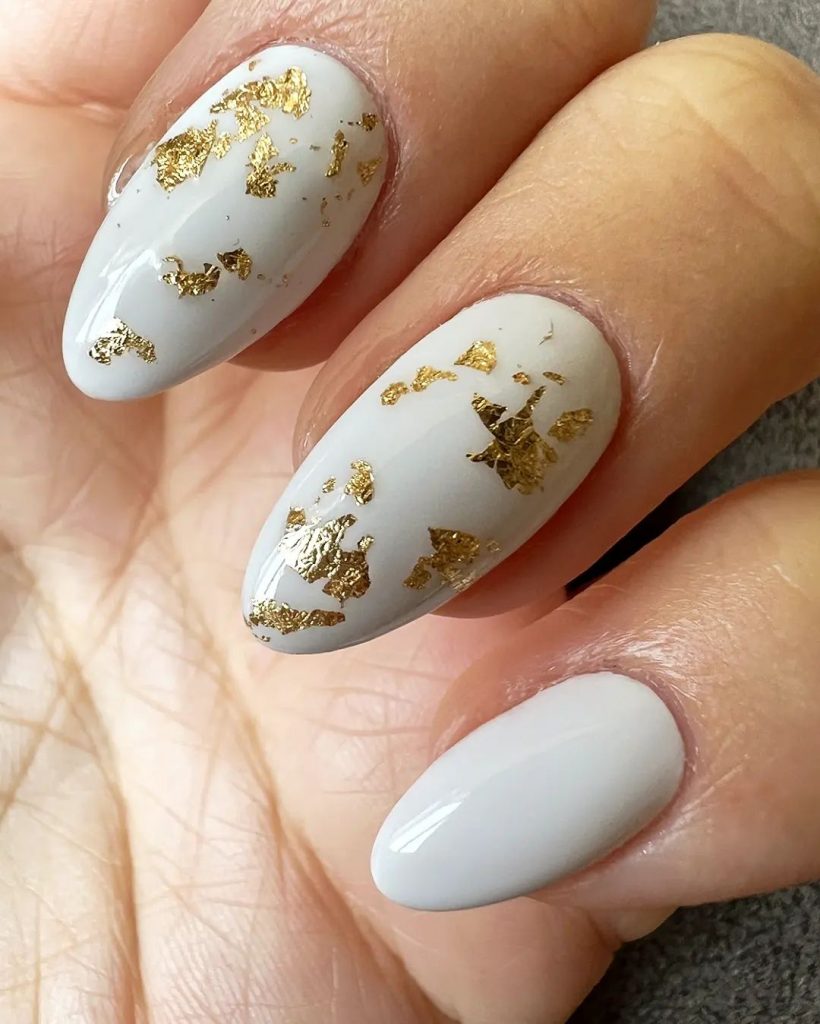 Elegant white and gold nail design