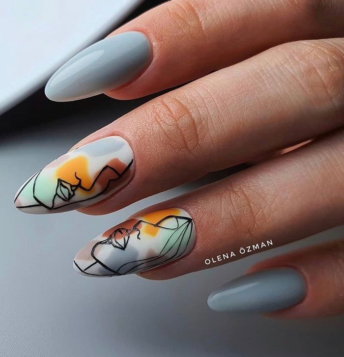 Abstract lady face on grey almond nails.