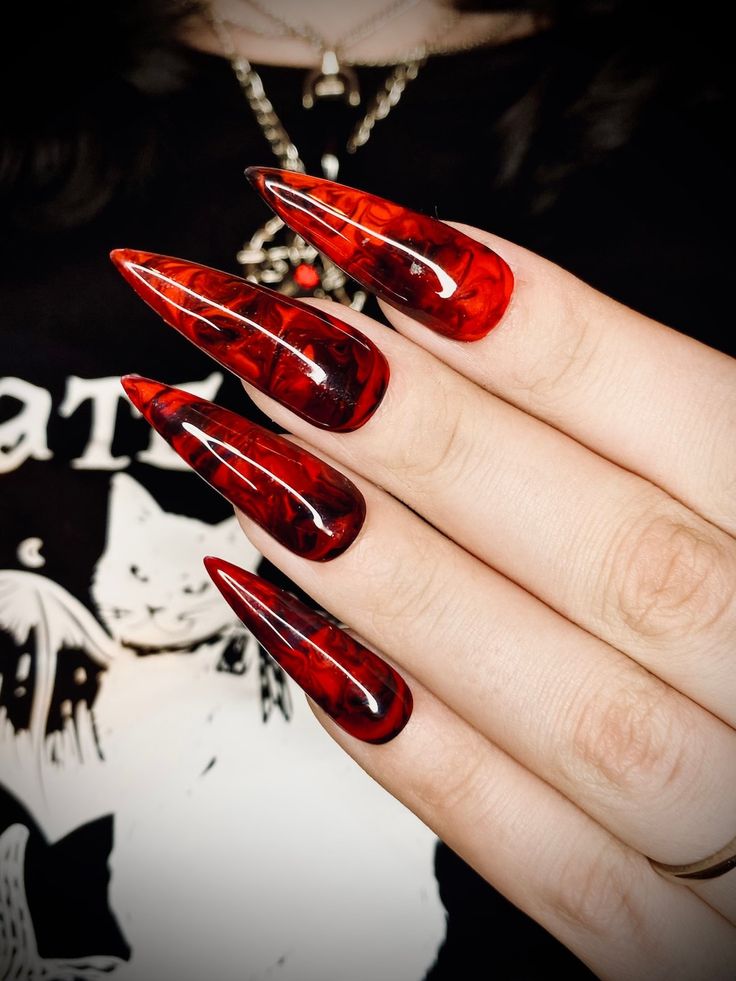 Red and black marble nails resembling blood splatter.